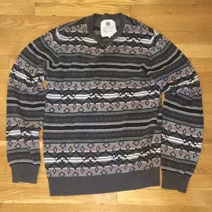 Gray patterned sweater.